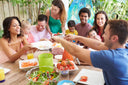 Multi-racial happy family on a wound healing diet enjoying their hearty meal