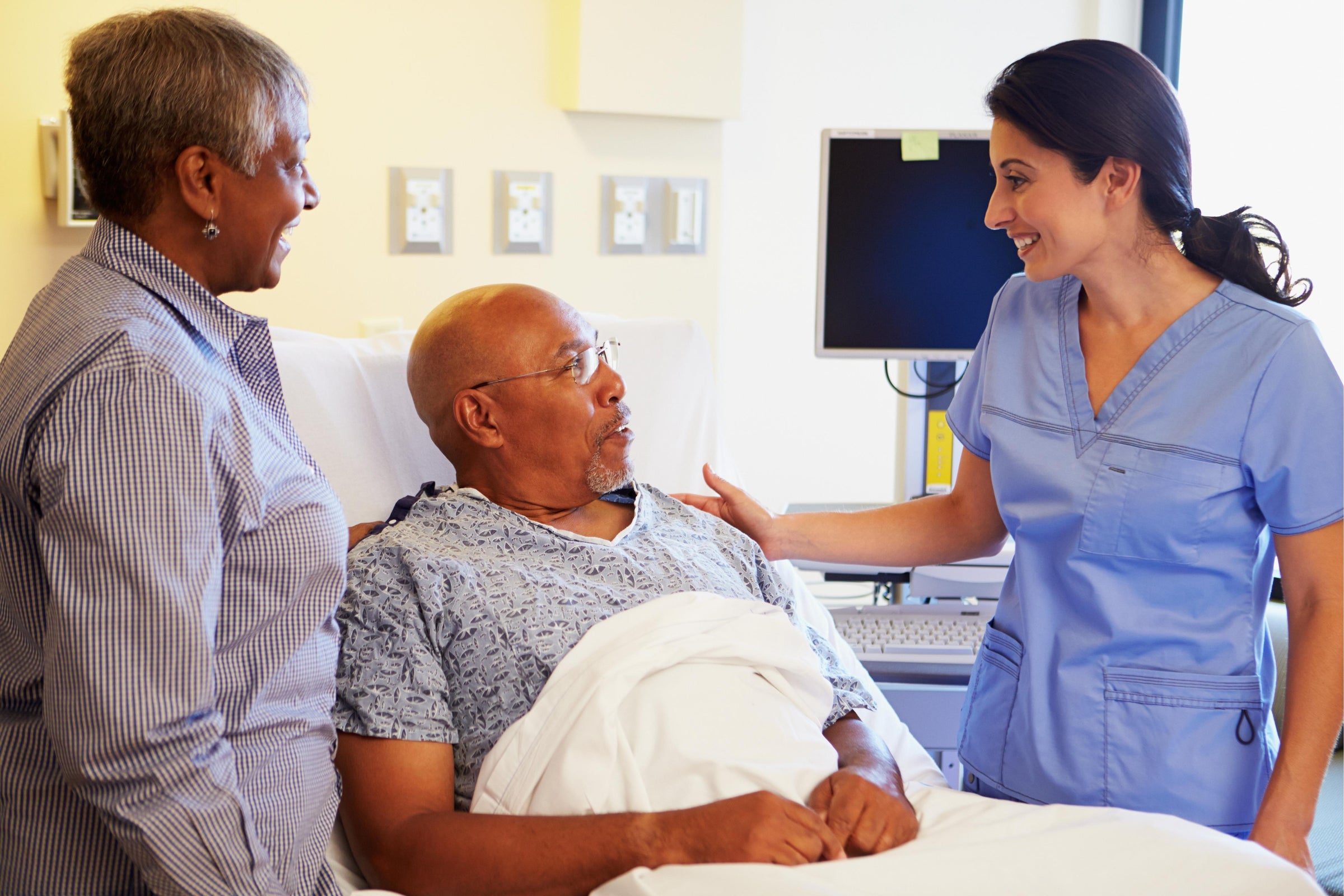 Patient in hospital bed asking a nurse, “Why is my operation wound not healing?”