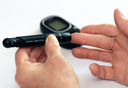 Woman is measuring the amount of sugar in her blood through a glucometer after taking protein drinks for diabetics