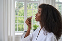 Young lady taking one of the best bariatric vitamins post-surgery