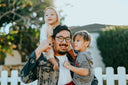 Dad who takes one of the best memory supplements for boosting brain power and strength is carrying his two kids