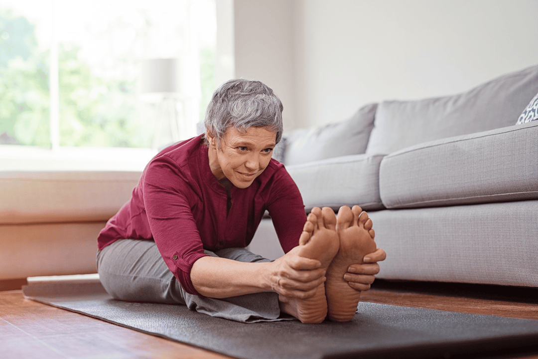 Mature woman doing yoga exercise - one of the best ways on how to treat carpal tunnel at home