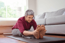 Mature woman doing yoga exercise - one of the best ways on how to treat carpal tunnel at home
