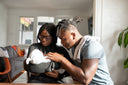 Proud couple looking at their first baby. Mom preparing for second child is wondering, “Can I take collagen while pregnant?”