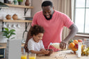Dad tips liquid collagen into his daughter's bowl with a grin, while telling her the best way to take collagen