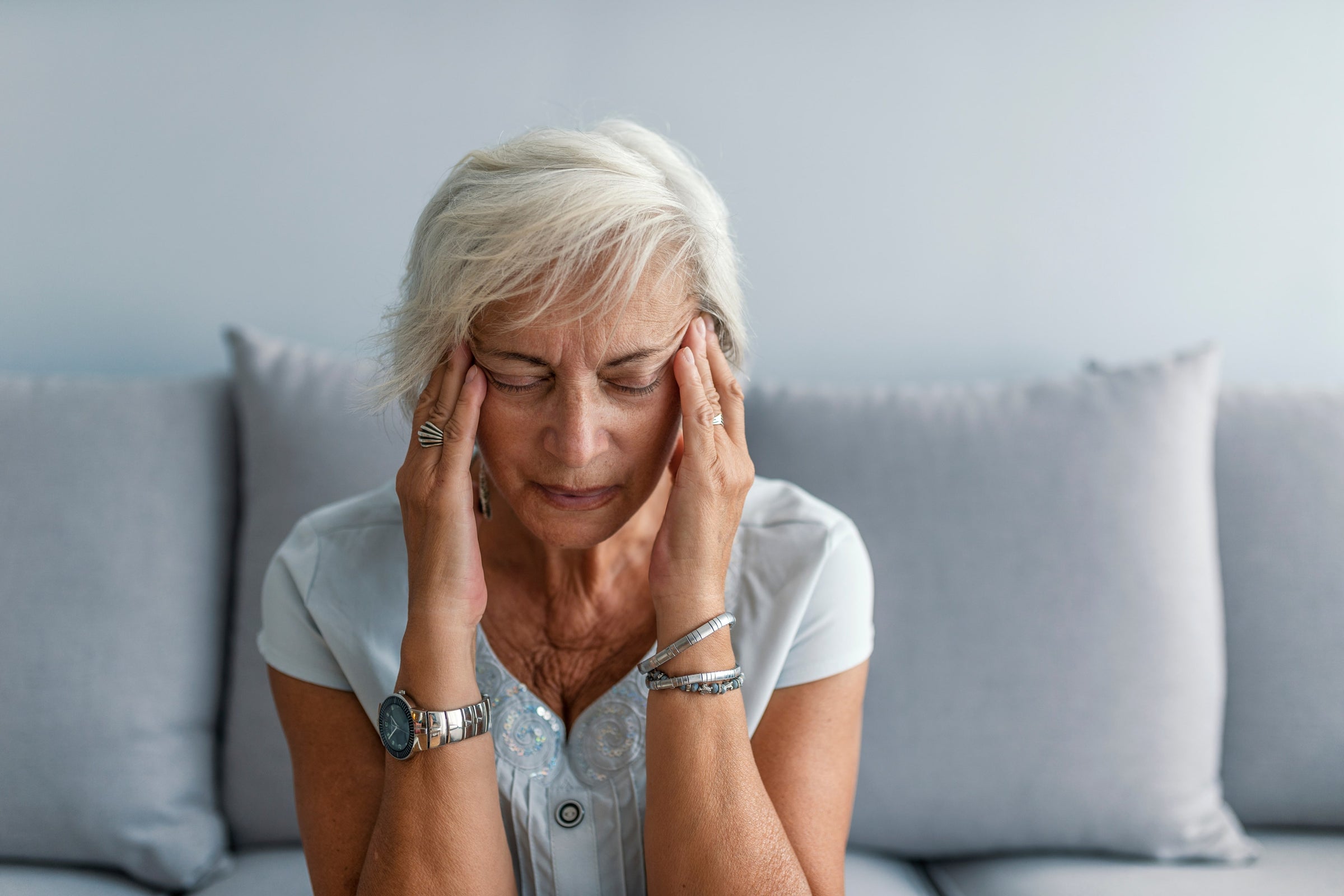 Woman with a headache is wondering: “ Can collagen cause headaches?”