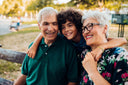 Grandson hugging grandparents who are talking about collagen wound care