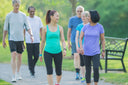 Friends going for a walk at a park to shorten gastric bypass recovery time