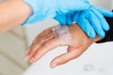 Nurse is taking care of a patient with a wound that won't close