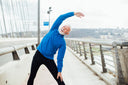 Man working out on an empty sidewalk while wondering, “How long does it take for collagen supplements to work?”