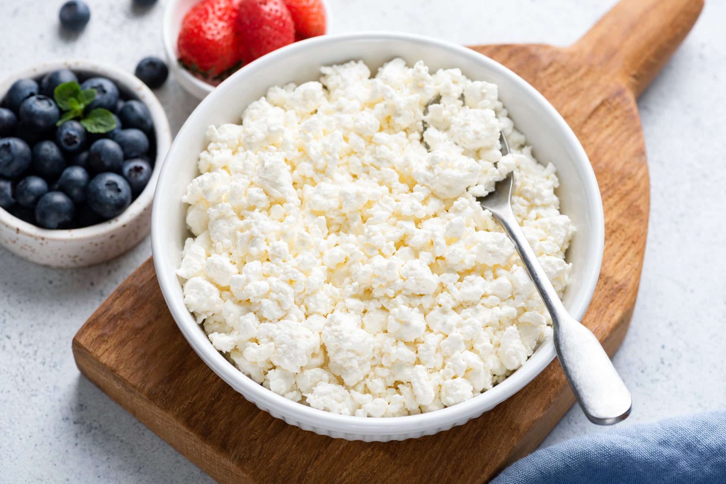 Homemade white cheese crumbles in a bowl, a delicious fix for enough protein