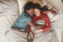 A couple taking an afternoon nap, one of the recommended solutions on how to heal deep wounds faster
