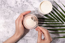 Woman pours collagen powder in her morning smoothie to support her rotator cuff tear therapies