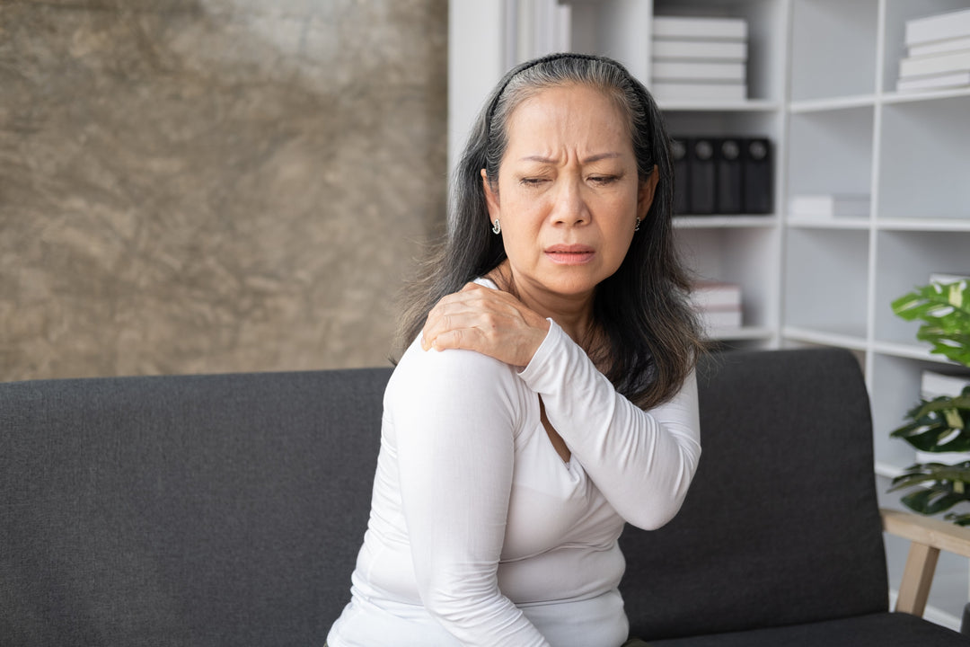 Middle-aged woman suffering from frozen shoulder needs supplements to heal rotator cuff tear