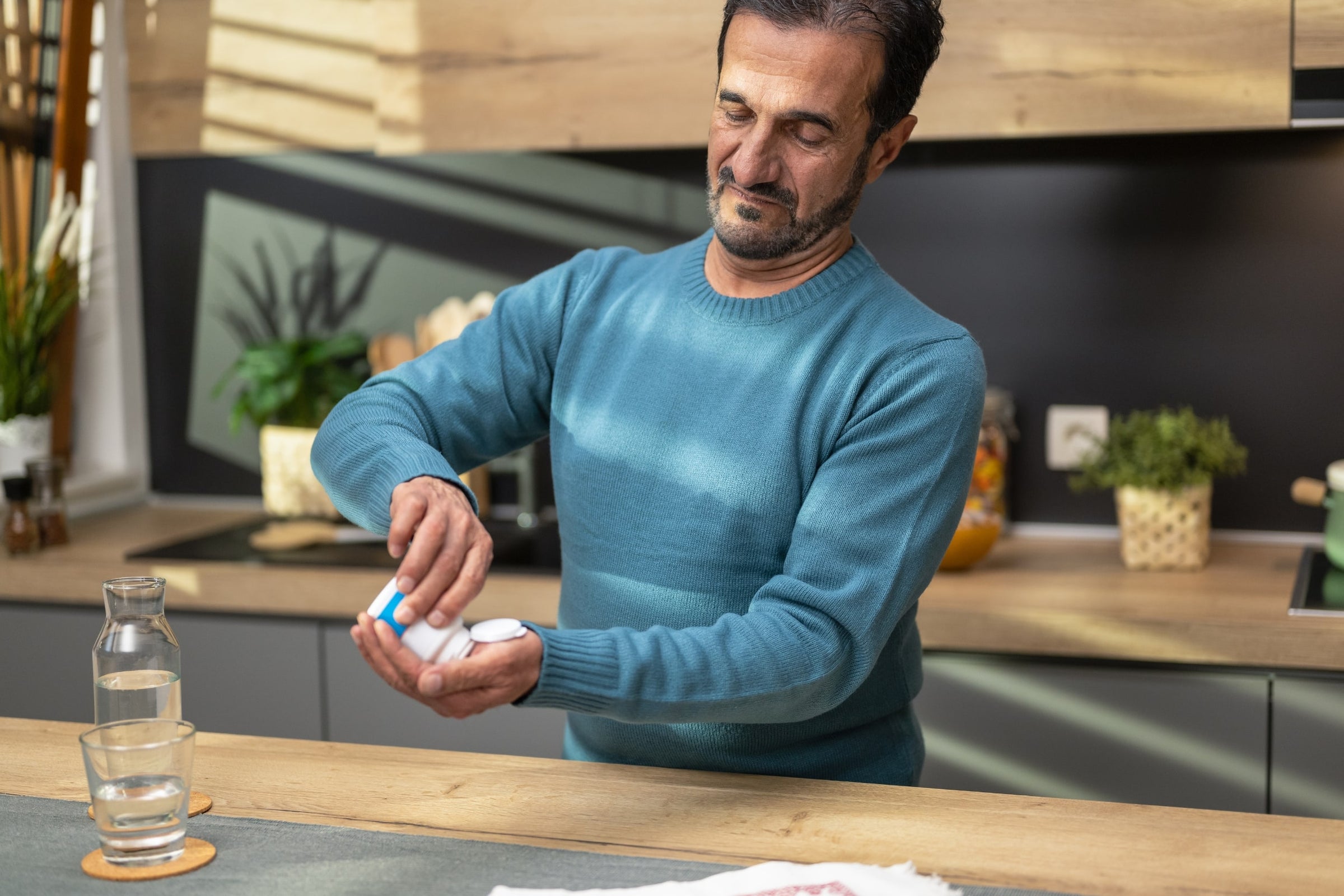 Senior man taking wound healing supplements