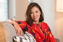 How to slow aging: Middle-aged woman smiling, looking radiant and healthy